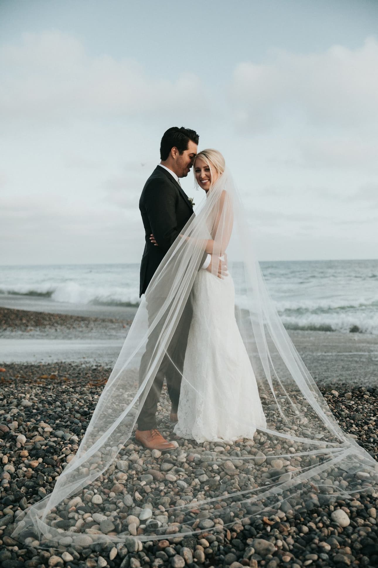 The couple sharing a quiet moment by the sea