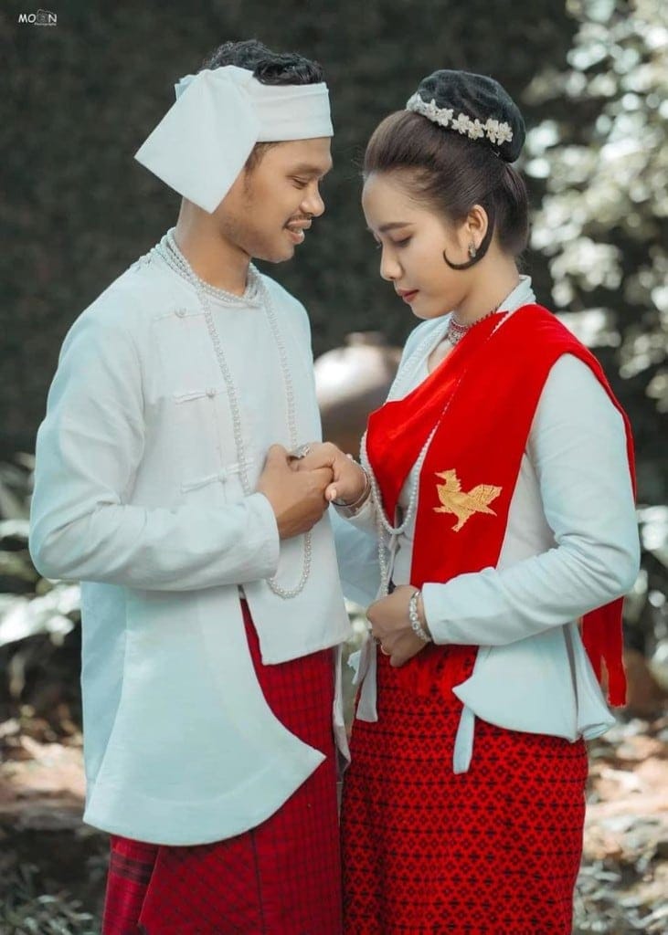 The couple in Mon traditional dress, the bride's red shawl embroidered with a golden Hintha